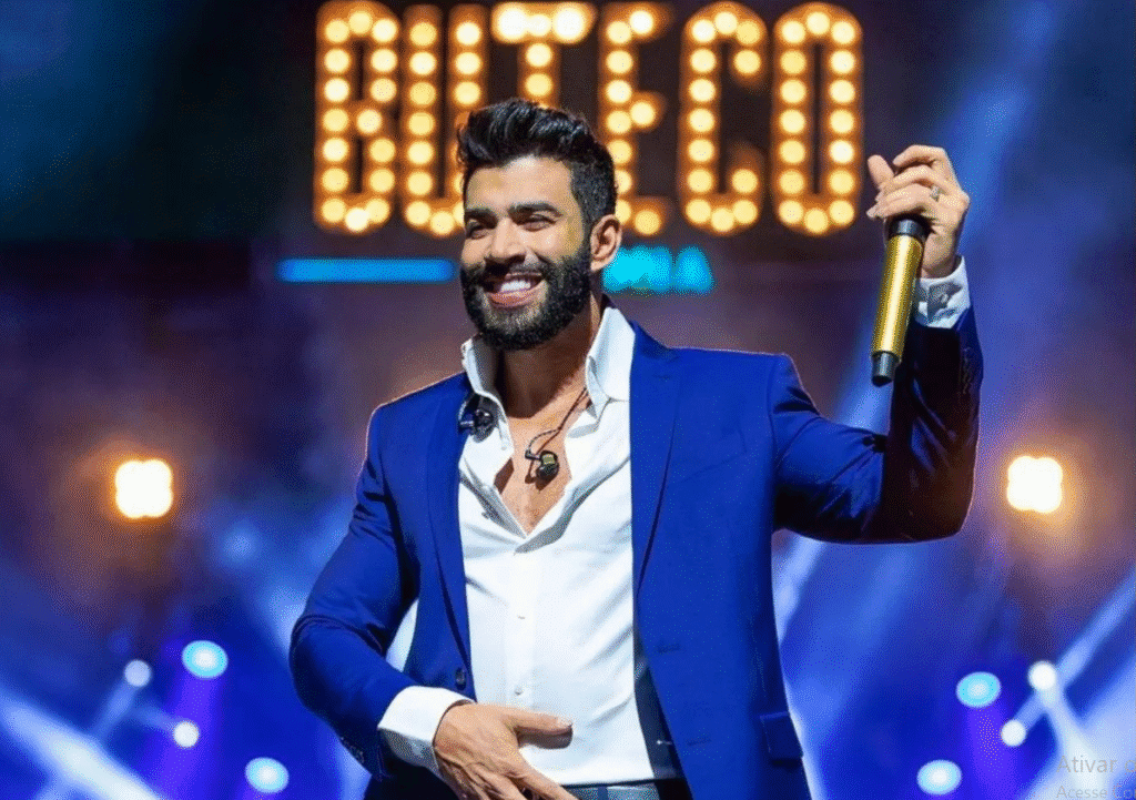 Gusttavo Lima em um show do Buteco, com público animado ao fundo