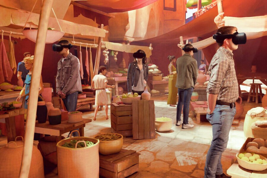 Coliseu em exposição imersiva em São Paulo, com visitantes interagindo em uma experiência de metaverso.